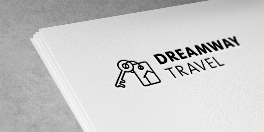 DREAMWAY TRAVEL Logo Das Logo von DREAMWAY TRAVEL auf einem Papierbogen